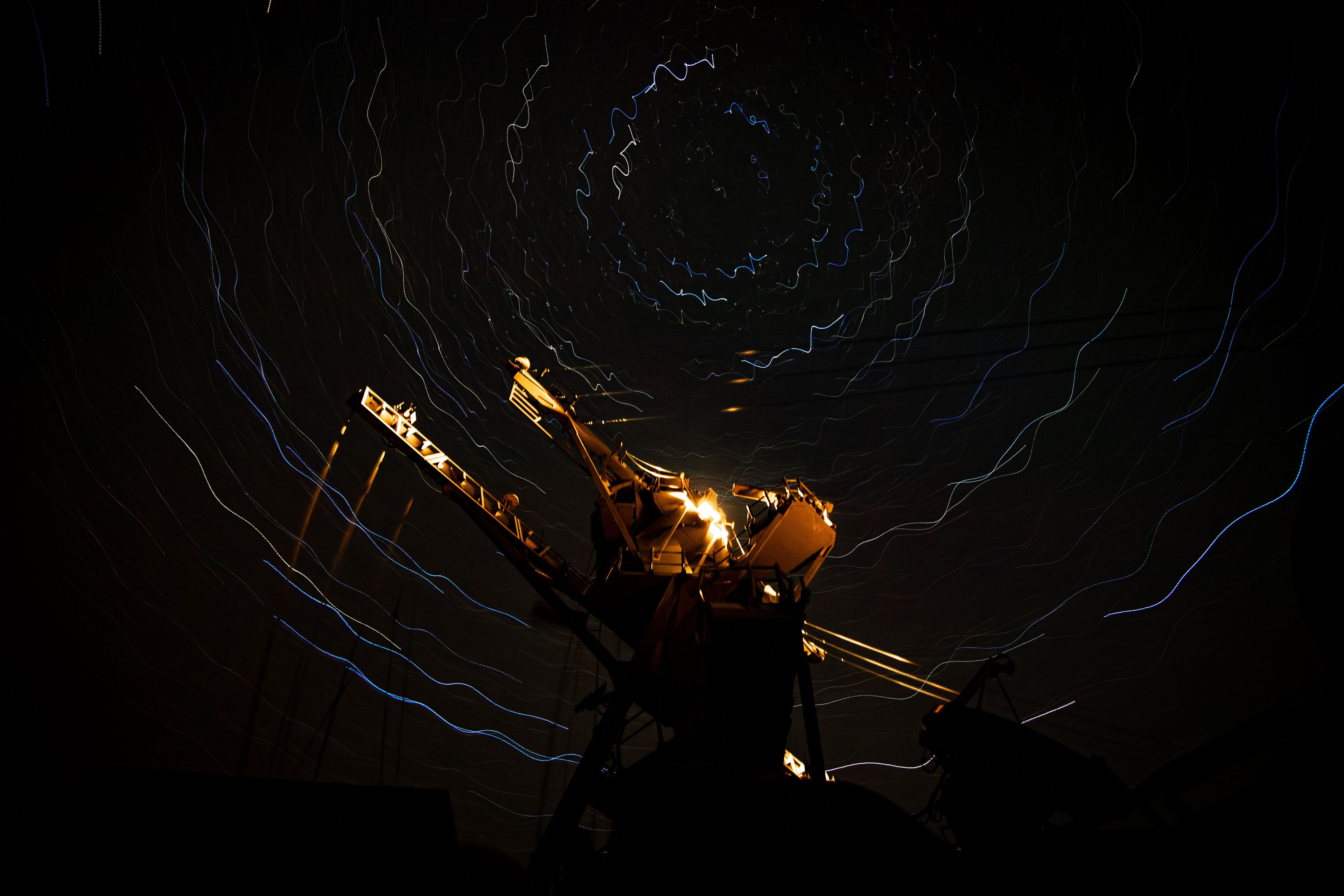 The guided-missile destroyer USS Gridley sails in the Philippine Sea at night, April 25, 2025.