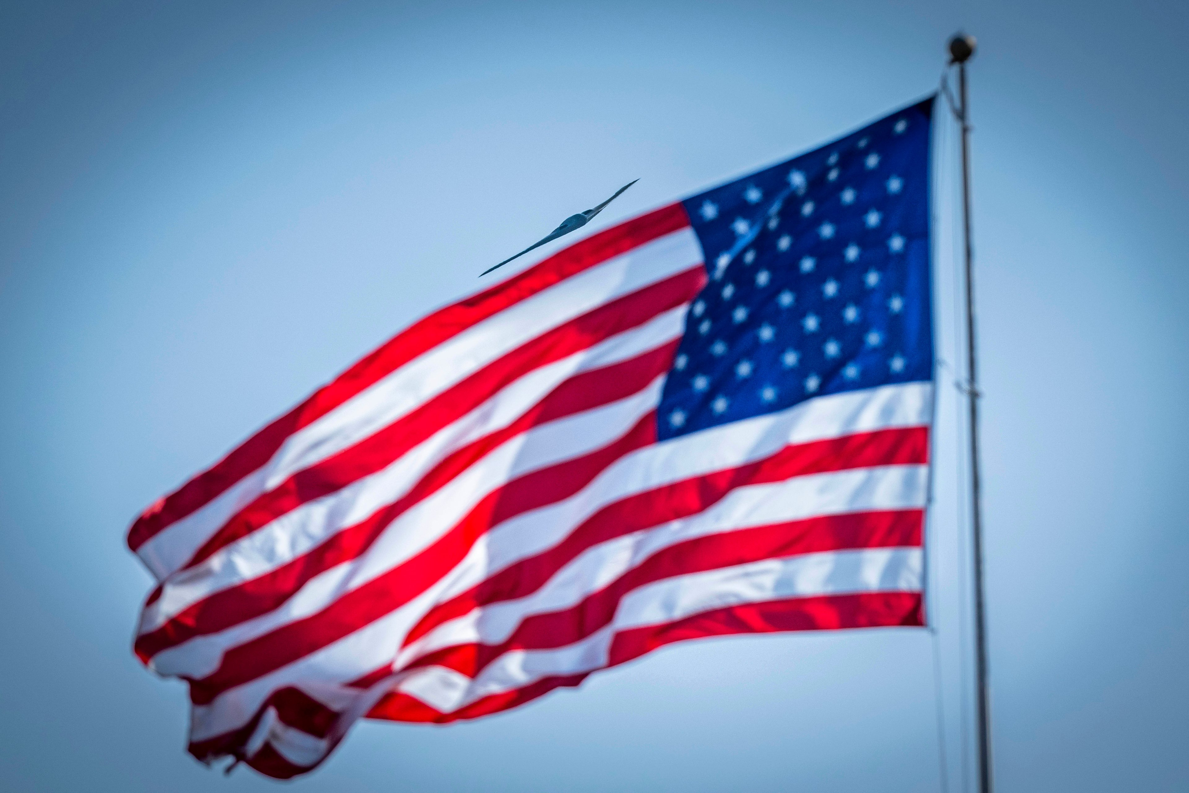 An Air Force B-2 Spirit stealth bomber performs a flyover during a basic military training graduation parade at Joint Base San Antonio, March 6, 2025.